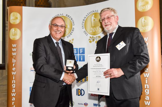 Elgood's Alan Pateman (right) receives award at IBA.